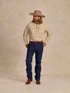 Dark blue denim dungarees on model, straight-leg with button front and rear yoke