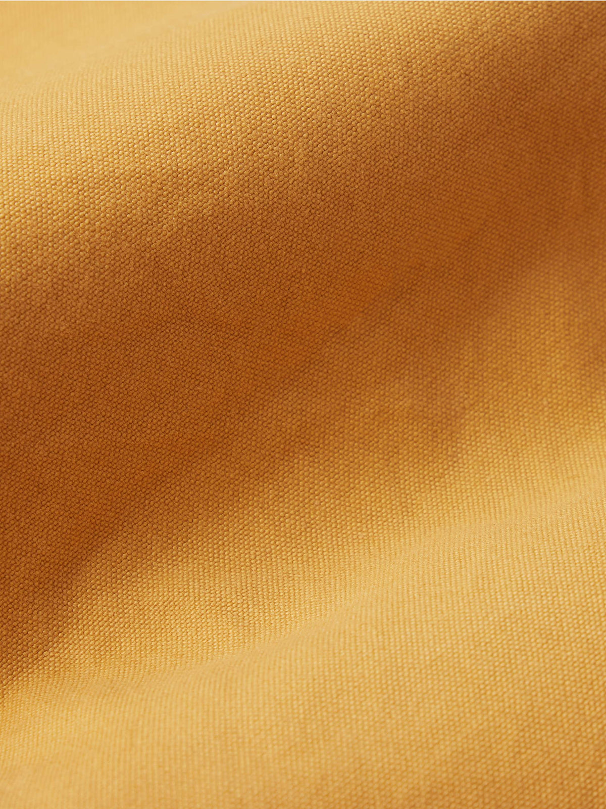 Suntan woven dungaree fabric texture close-up