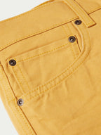 Suntan dungaree pants coin pocket with riveted buttons and stitching