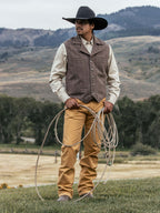 Tan dungaree pants with belt loops, front fly, and straight-leg fit