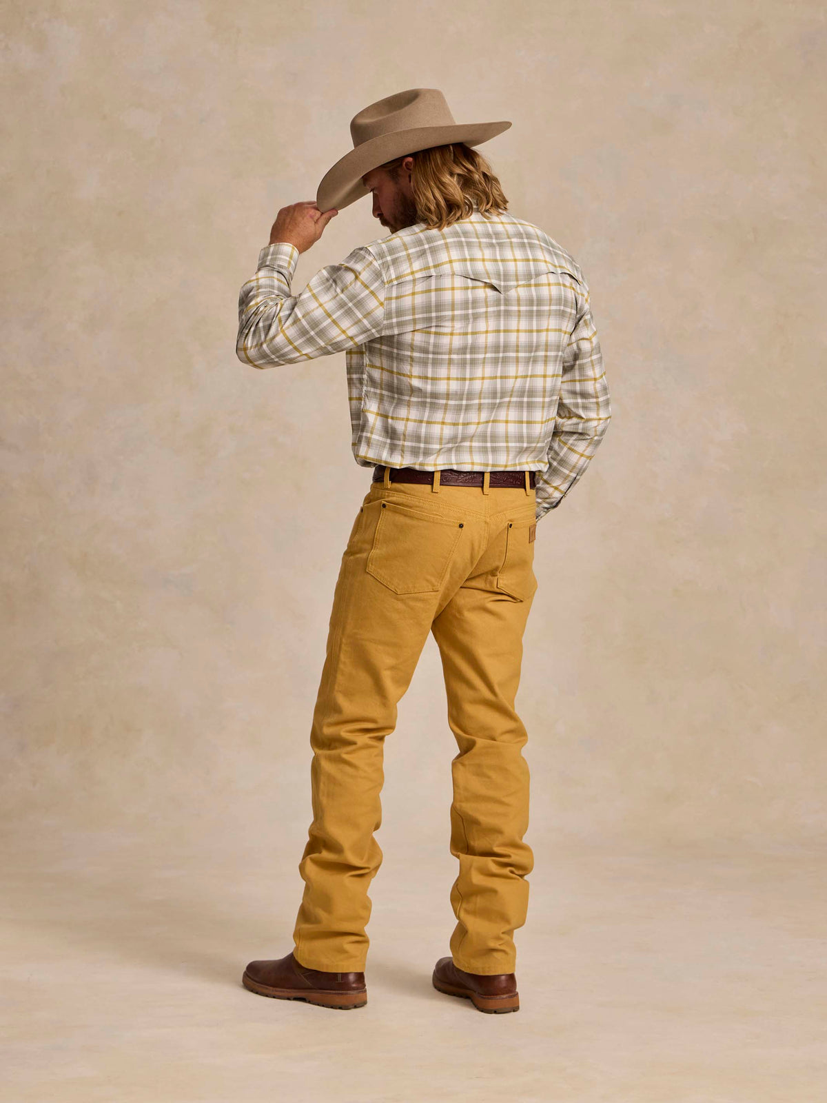 Suntan work dungaree pants, rear view, belt loops and straight legs