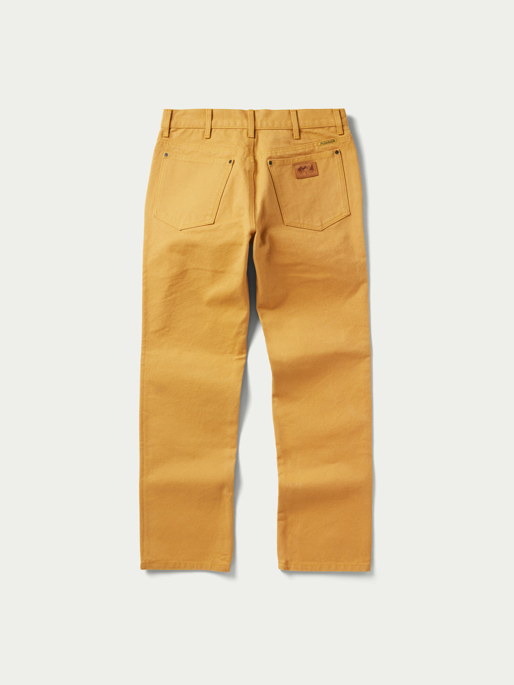 Tan canvas dungaree pants with straight legs, front pockets, and belt loops