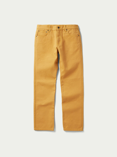 Tan canvas dungaree pants front view with two pockets and metal button