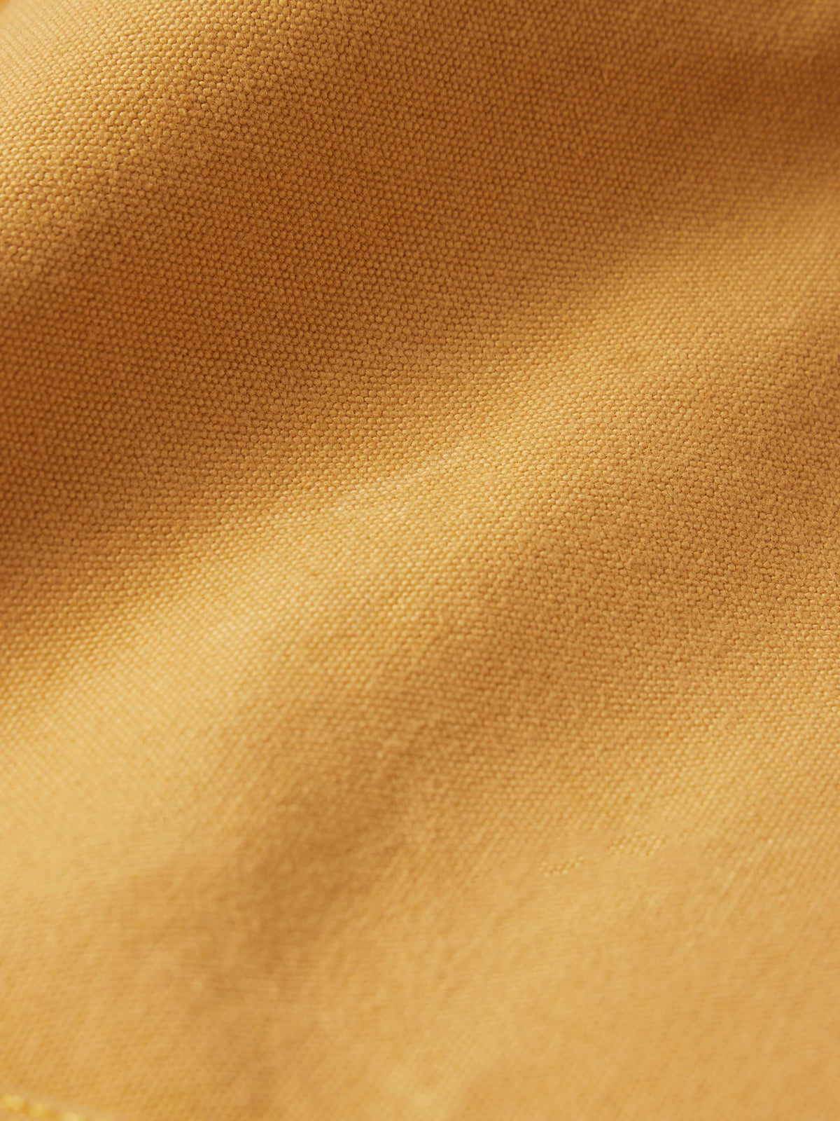 Tan woven canvas fabric texture for dungaree pants