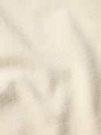 Natural denim fabric texture close-up with subtle twill weave
