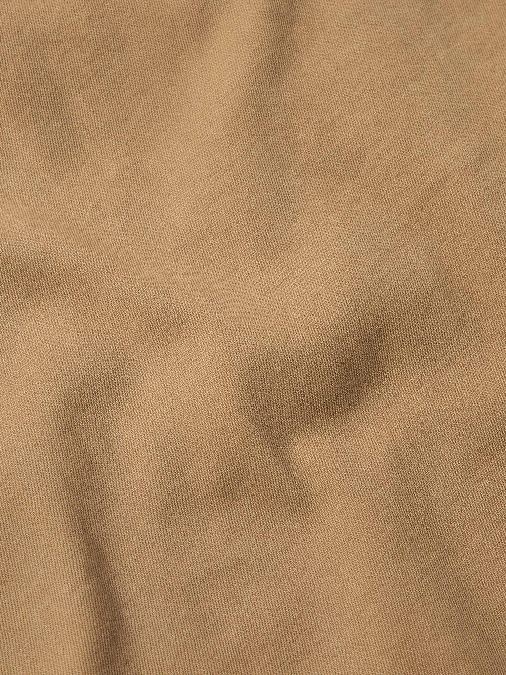 Tan denim fabric texture close-up