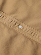Tan shirt yoke with metal snap buttons
