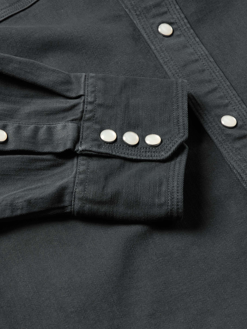 Slate denim snap western shirt, chest snap pocket row and yoke seam