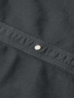 Slate denim snap shirt yoke seam with single snap button detail