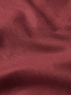 Mahogany fabric close-up with subtle woven texture