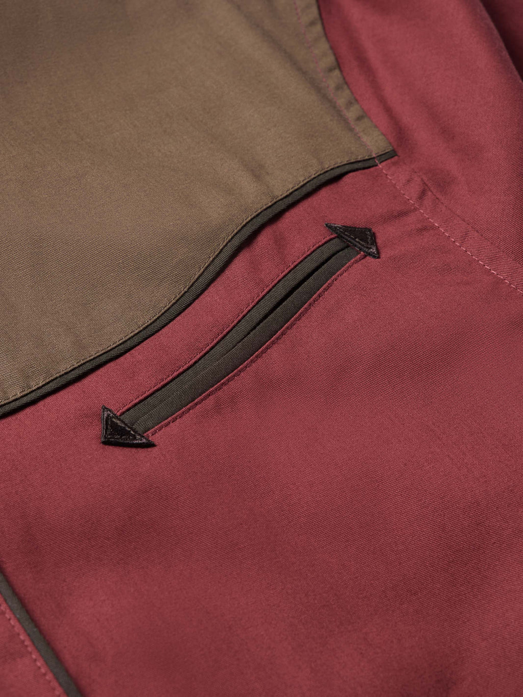 Mahogany snap shirt sleeve placket with black arrow trim and snap details