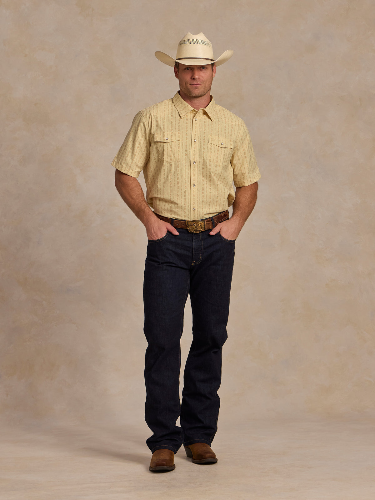 Short sleeve pearl snap western shirt, light cream patterned; full view being worn.