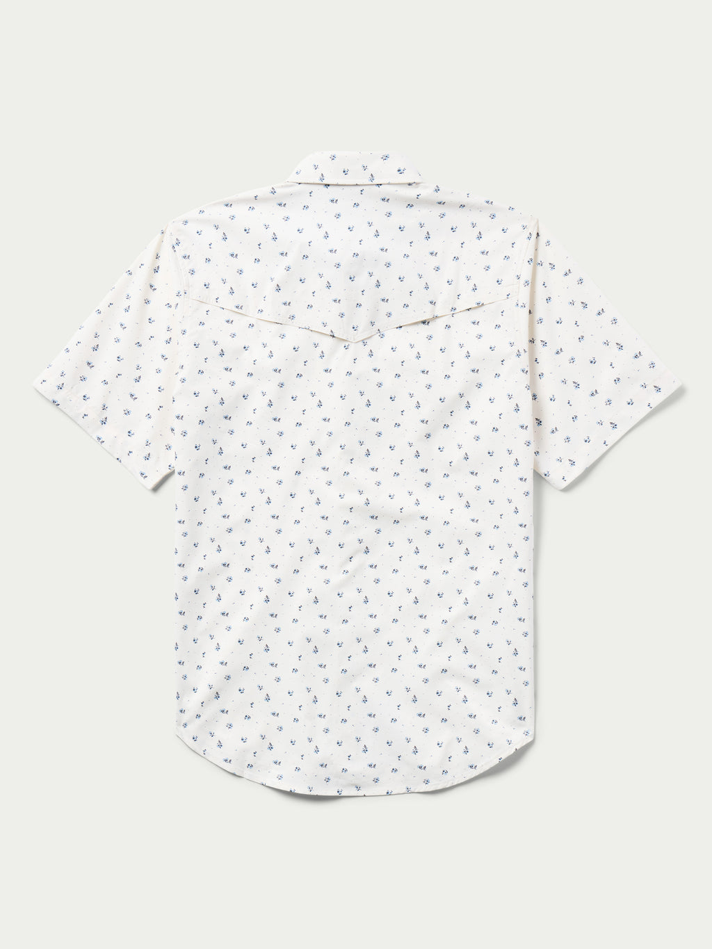 Short-sleeve pearl snap shirt in white with small blue floral pattern, button placket.