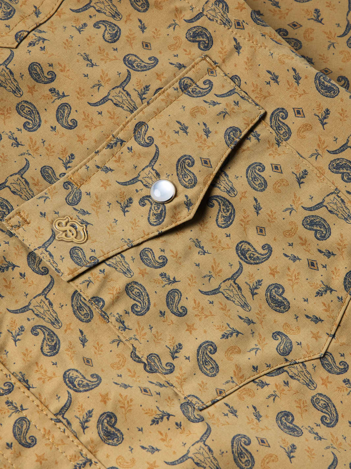 Western shirt chest yoke and pearl snap on patterned short sleeve placket.