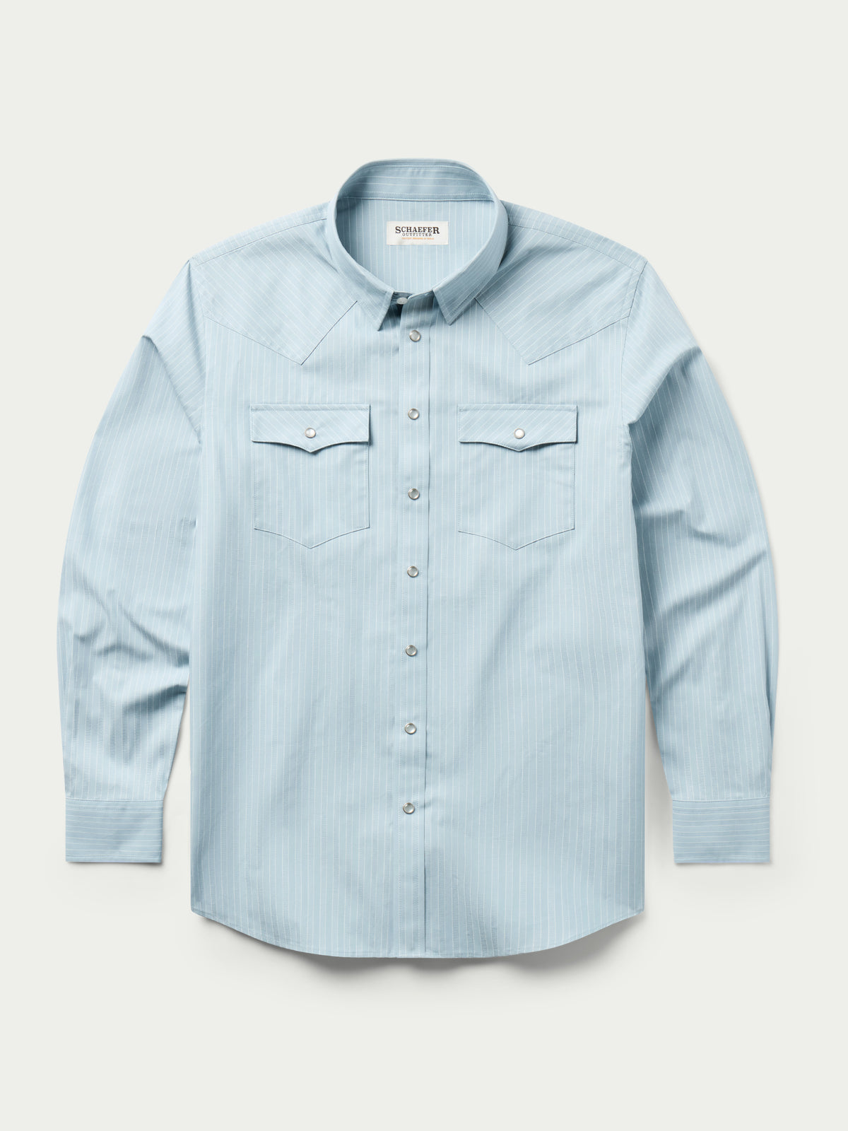 Light blue western button-down shirt with flap chest pockets and snap placket
