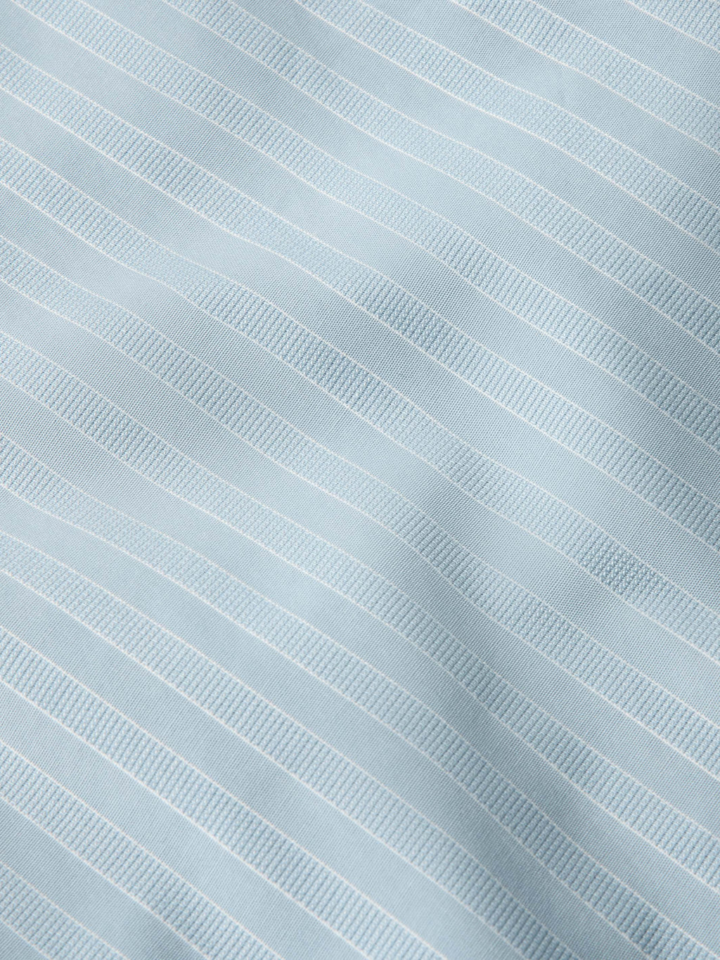 Light blue pinstripe fabric texture with fine vertical stripes