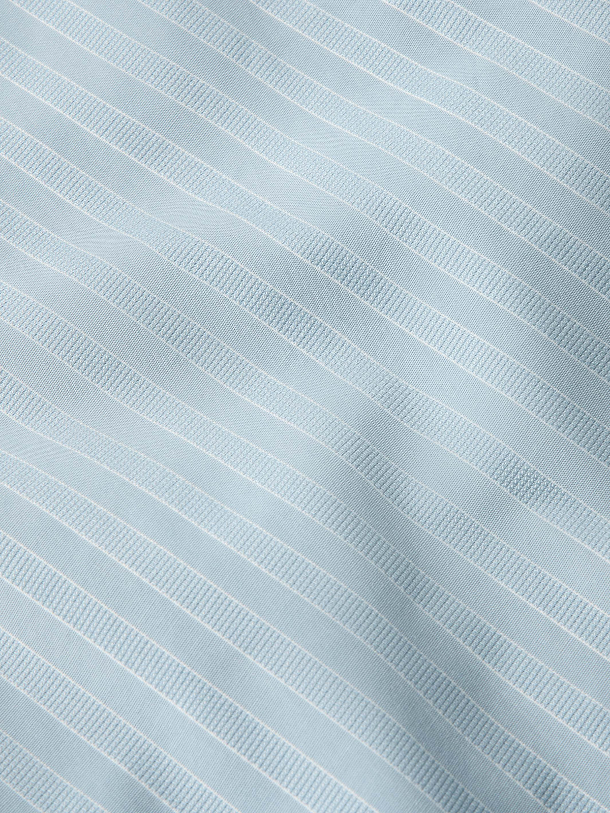 Light blue pinstripe fabric texture with fine vertical stripes