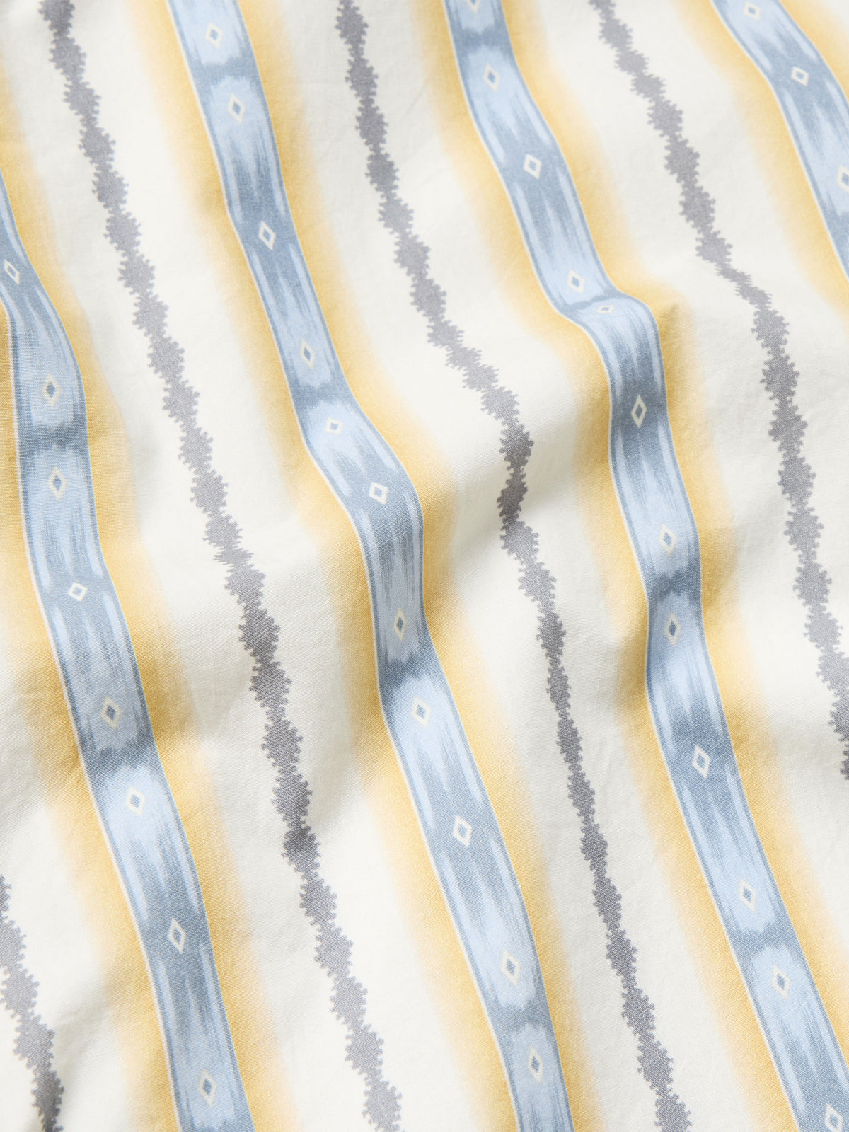 Light blue and white vertical stripe fabric for a cotton snap shirt