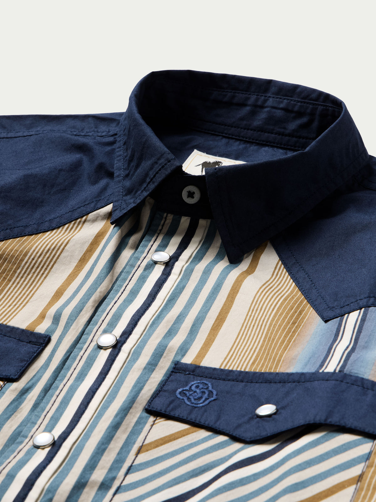 Cotton snap shirt collar and placket, navy contrast trim with blue/tan stripe front