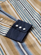 Cotton snap shirt cuff and sleeve tab detail, blue/tan stripes with navy snaps