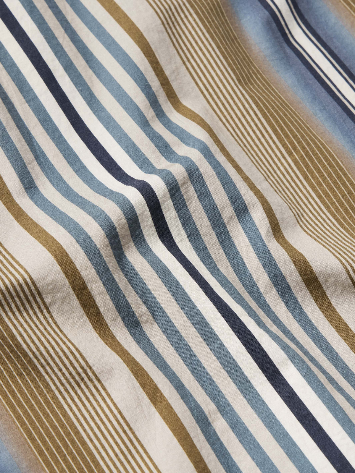Cotton fabric swatch with blue and tan vertical stripe pattern
