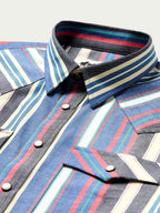 Western snap shirt close-up: striped collar, black snap placket, contrast snap buttons