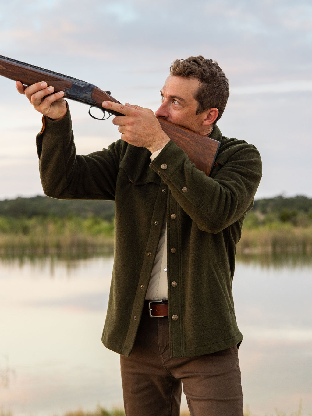 Olive wool overshirt on a man, buttoned front with chest pockets