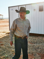 Sage western snap denim shirt worn by a man, showing chest pockets and cuffs