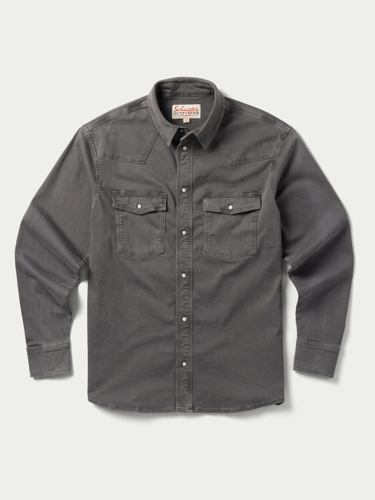 Men's western denim snap shirt front view with two chest flap pockets and snap buttons.