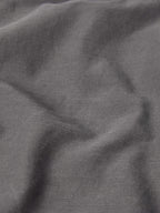 Dark carbon gray denim fabric close-up from a men's western snap shirt.