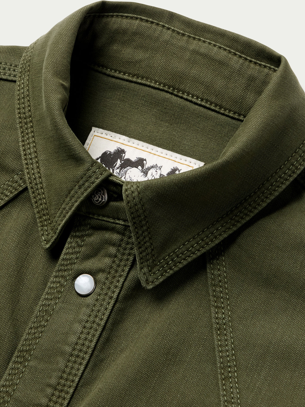 Dark olive denim snap shirt with snap button at collar and contrast stitching