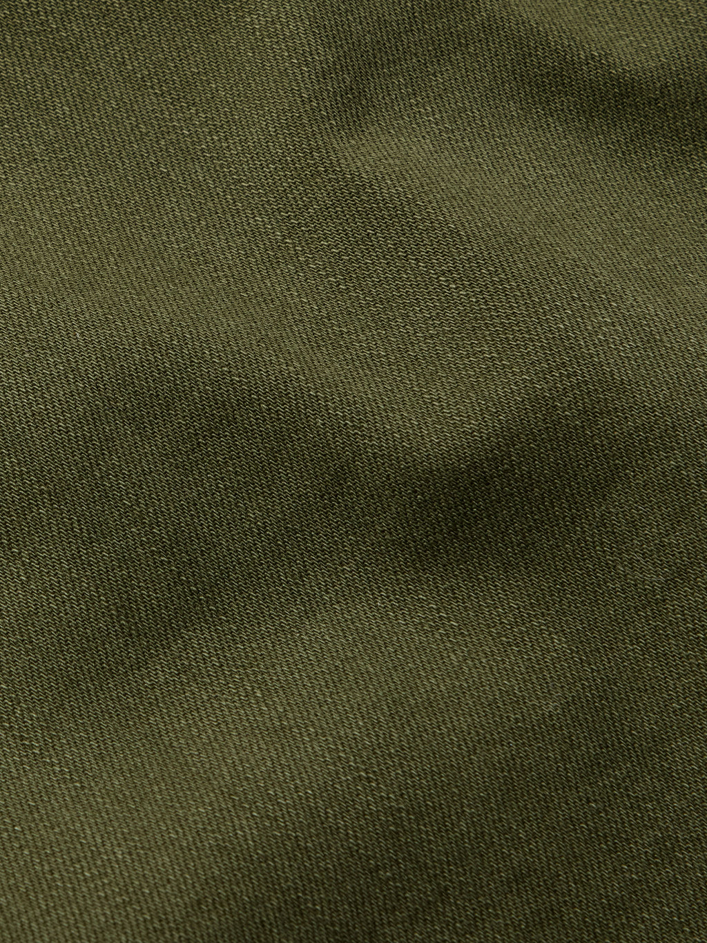 Dark olive textured denim fabric close-up