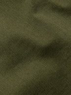 Dark olive textured denim fabric close-up