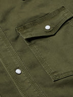 Dark olive denim snap shirt chest pocket with white snap button
