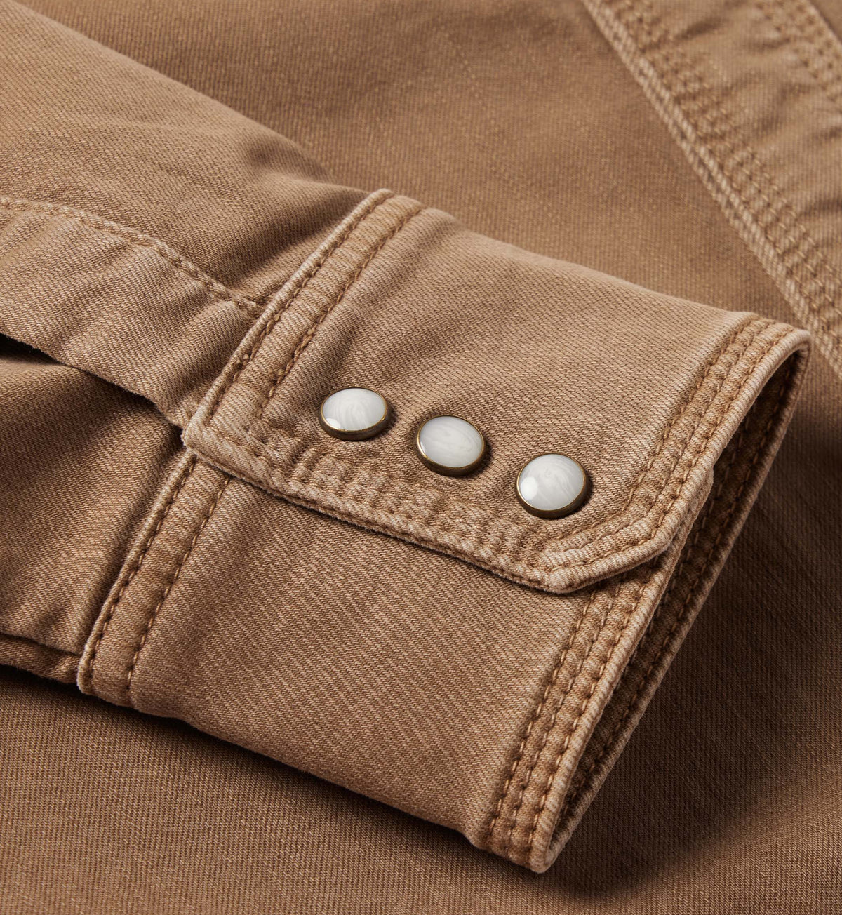 Khaki denim snap shirt cuff with round snap buttons and stitching