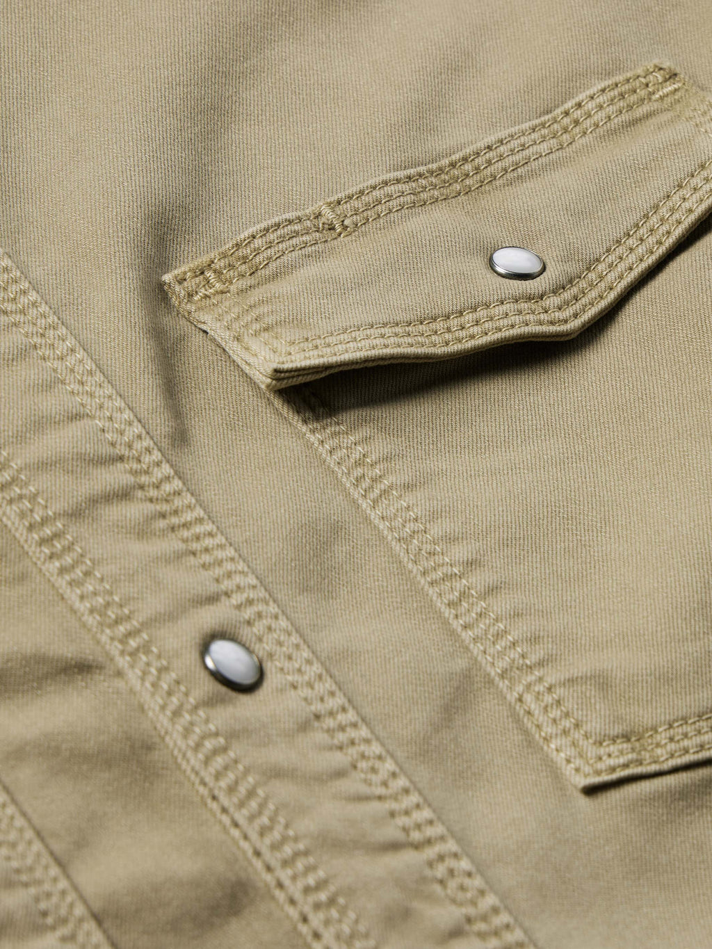 Sage western snap denim shirt front close-up with visible snap and double stitching