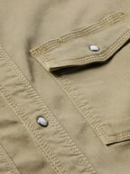Sage western snap denim shirt front close-up with visible snap and double stitching