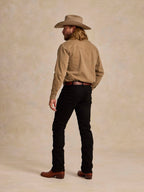 Khaki western snap shirt worn on person, long sleeves and buttoned cuffs