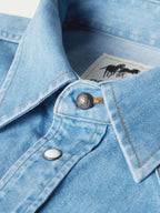 Light-wash denim snap shirt collar detail, snap placket and interior neck label