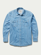 Light-wash denim snap shirt front view, long sleeves with two chest snap pockets