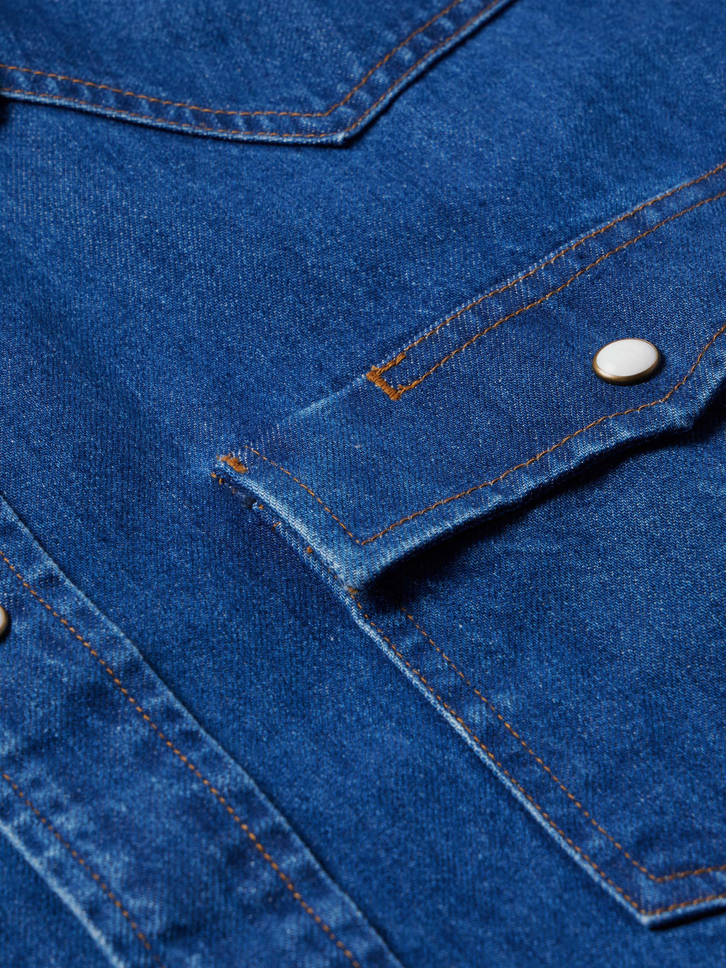 Dark indigo denim snap shirt with yoke seam and snap button detail