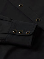 Black western shirt placket with snap buttons and long sleeves