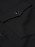 Black chest pocket with snap button detail