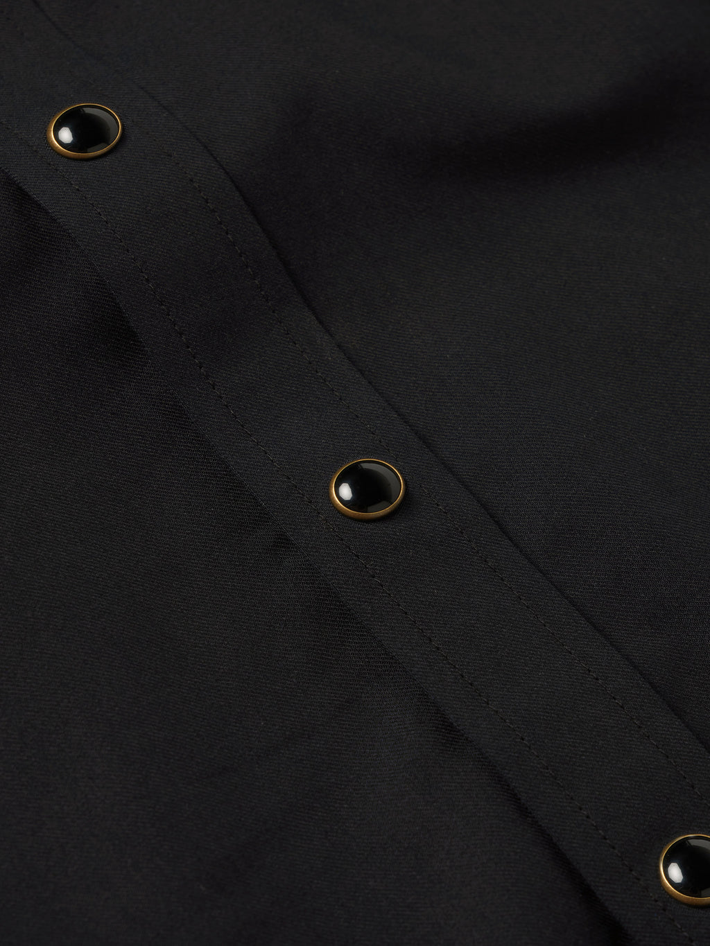 Black shirt cuff with snap buttons