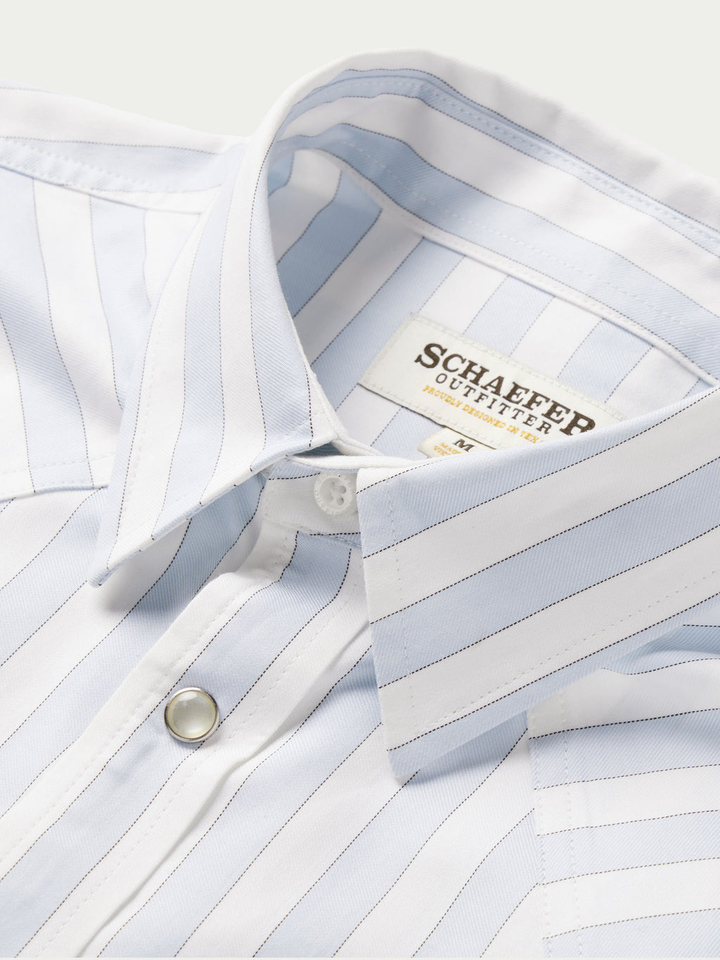 Light blue striped button-down shirt collar with snap placket and inner label