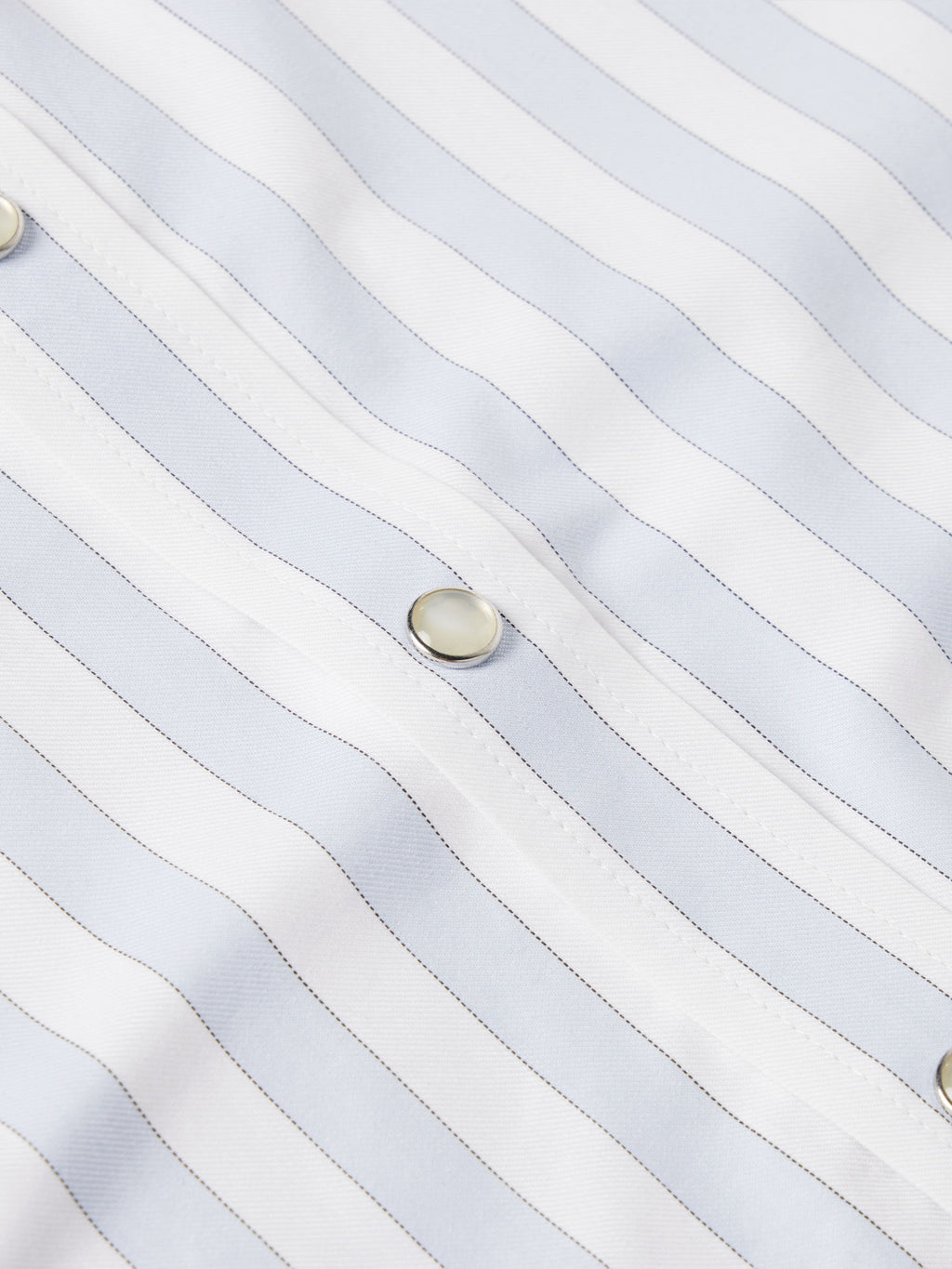 Light blue striped shirt fabric with snap button detail
