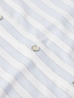 Light blue striped shirt fabric with snap button detail
