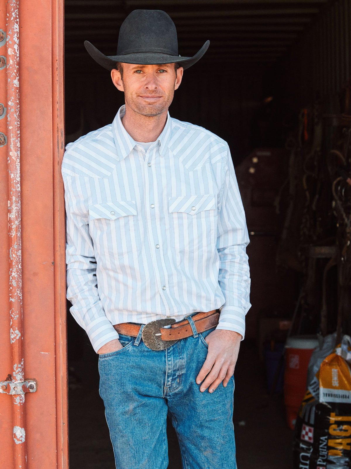 Light blue striped Western button-down shirt with snap cuffs and chest pockets