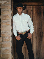 White western button-down shirt with snap front worn with dark pants