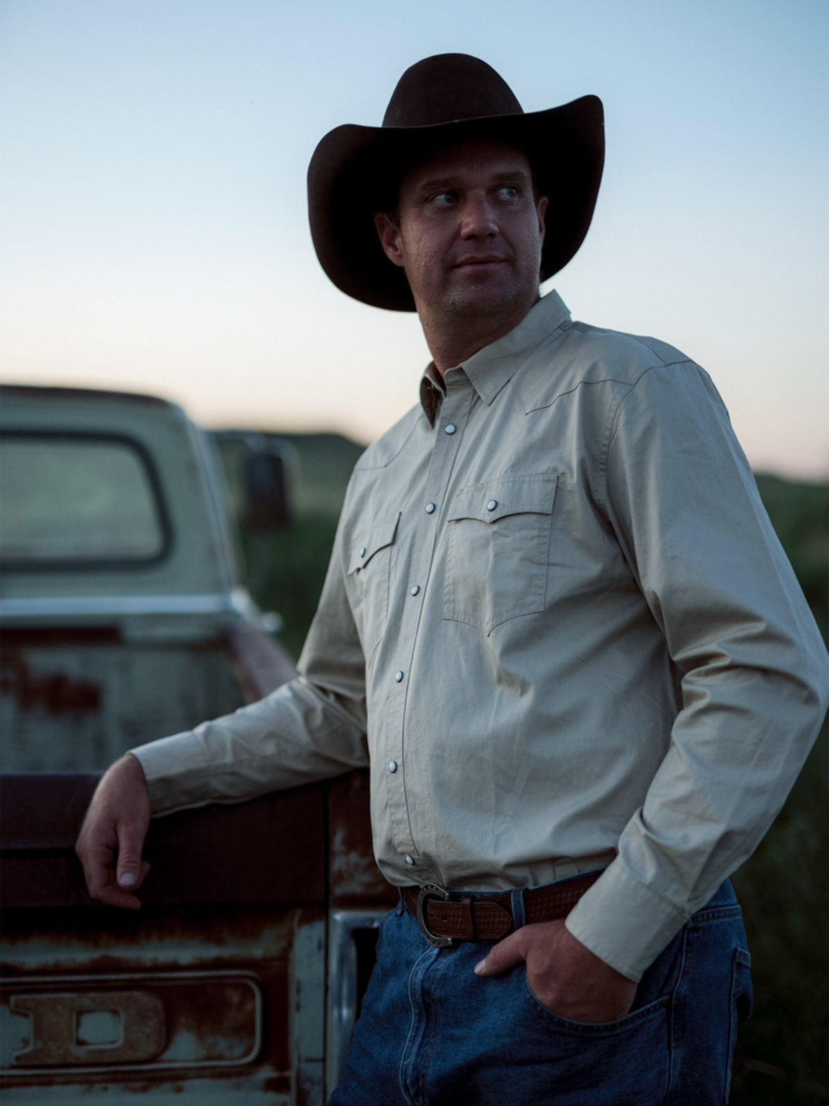 Light blue long-sleeve button-up shirt with snap cuffs and flap chest pockets